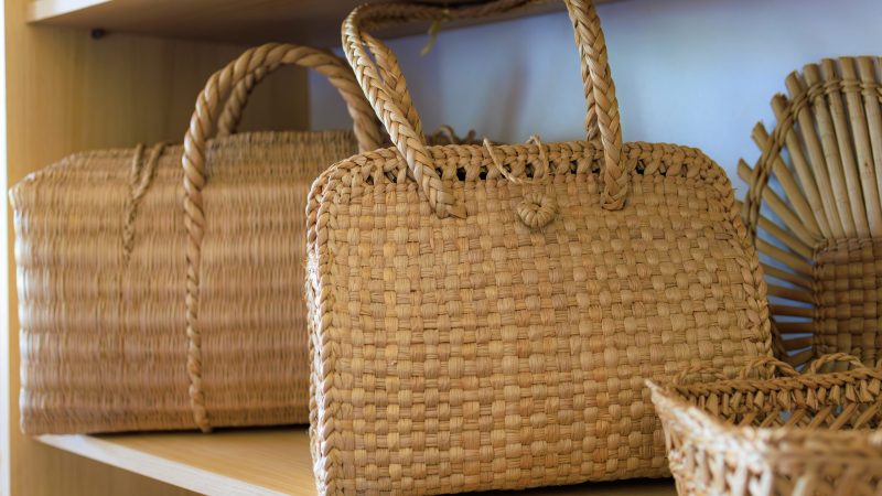 Straw woven bags. Background with selective focus and copy space Straw woven bags. Background with selective focus and copy space for text